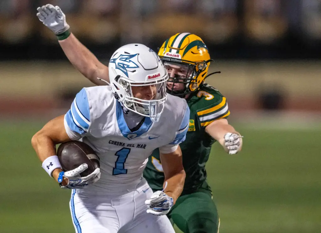 Corona del Mar wide receiver JJ Haley (1) carries the...