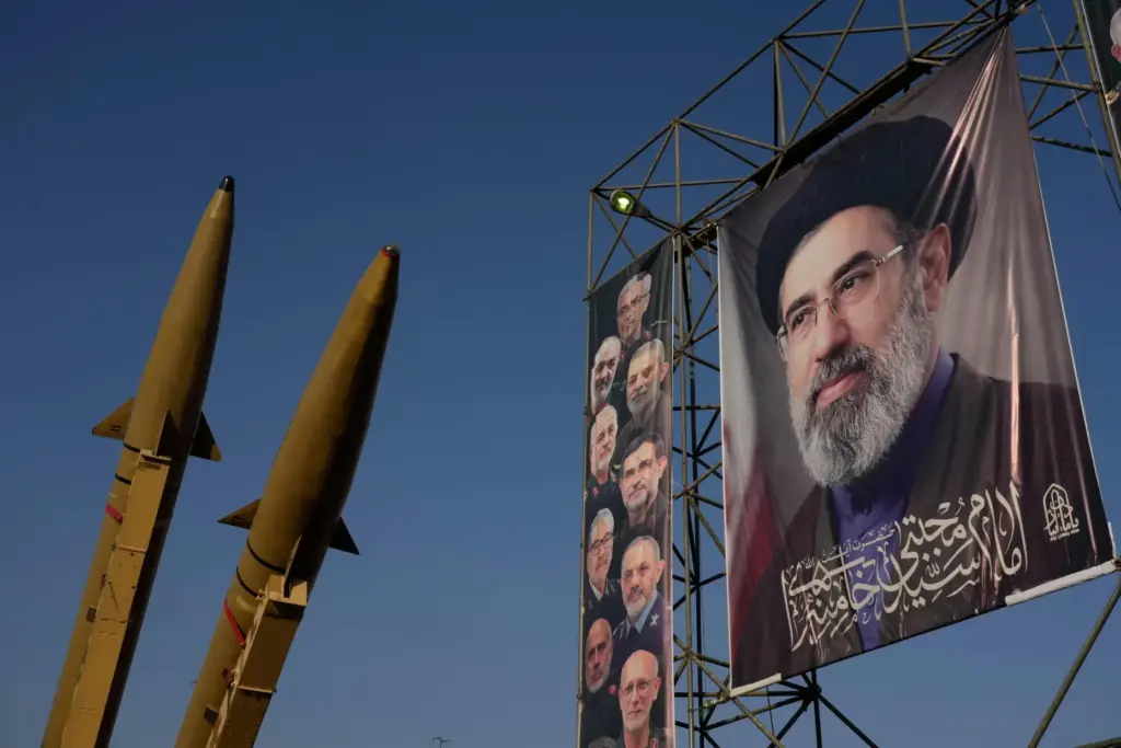 Iranian missiles and banners showing portraits of the Iranian Supreme Leader Ayatollah Mojtaba Khamenei
