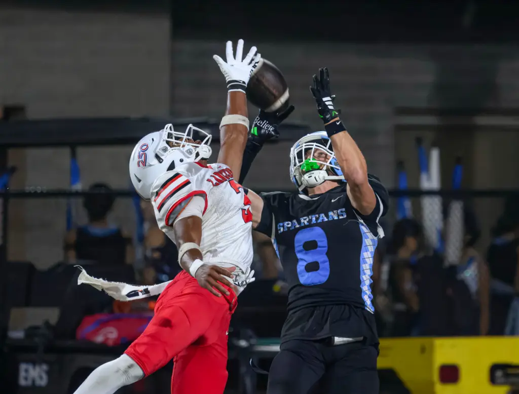 Villa Park receiver Ethan Hedrick, right, makes a touchdown catch...