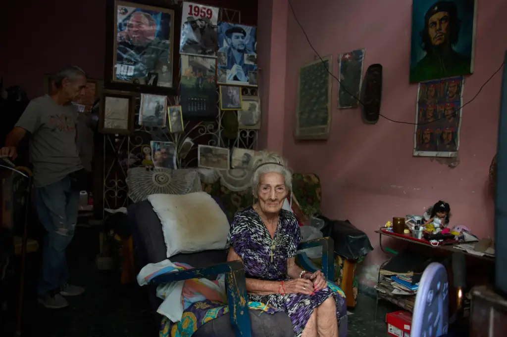 Teresita del Rosario GonzÃ¡lez Ricardo poses for a photo, accompanied by her son JosÃ© Manuel Borroto.
