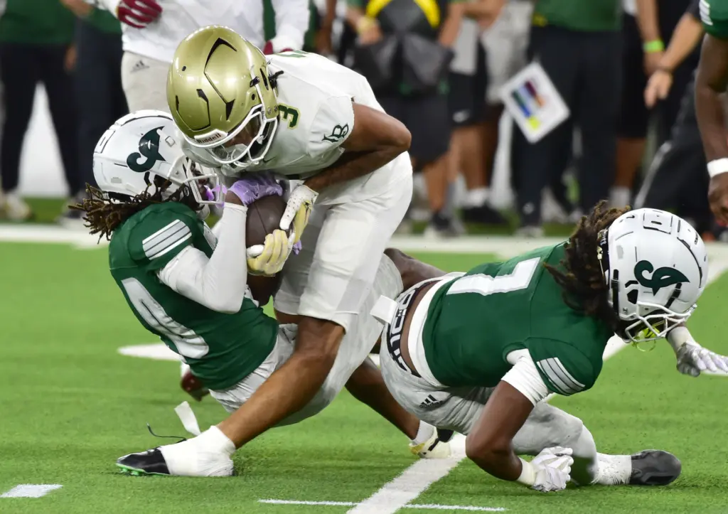 Long Beach Poly receiver Jayden Coley takes an awkward hit...