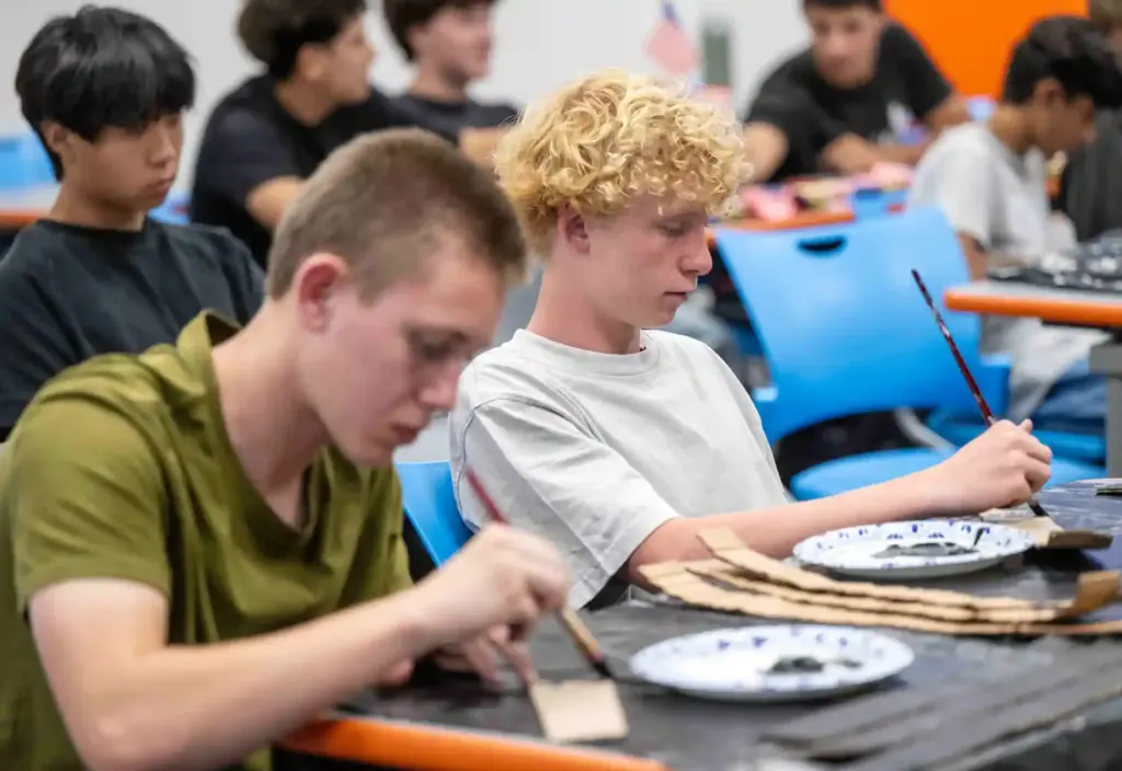 Collin Bensavage, left, a senior at Los Alamitos High School,...
