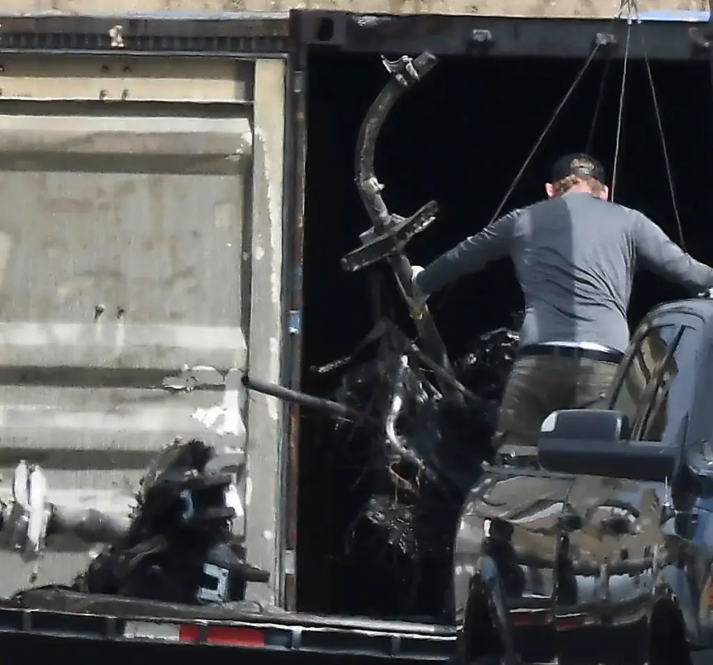 Salvage crews help NTSB investigators remove of whatâs left of...