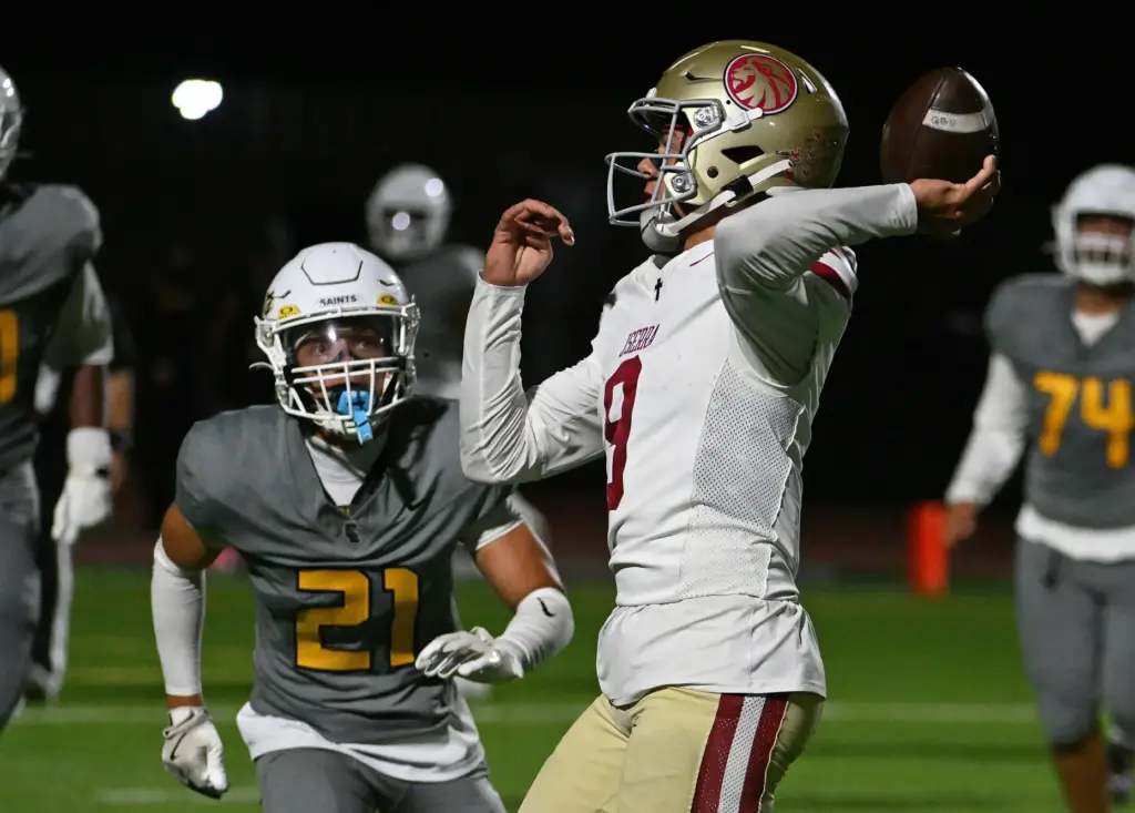 JSerraâs Hayes Cloutier (9) throws a touchdown pass as Crean...