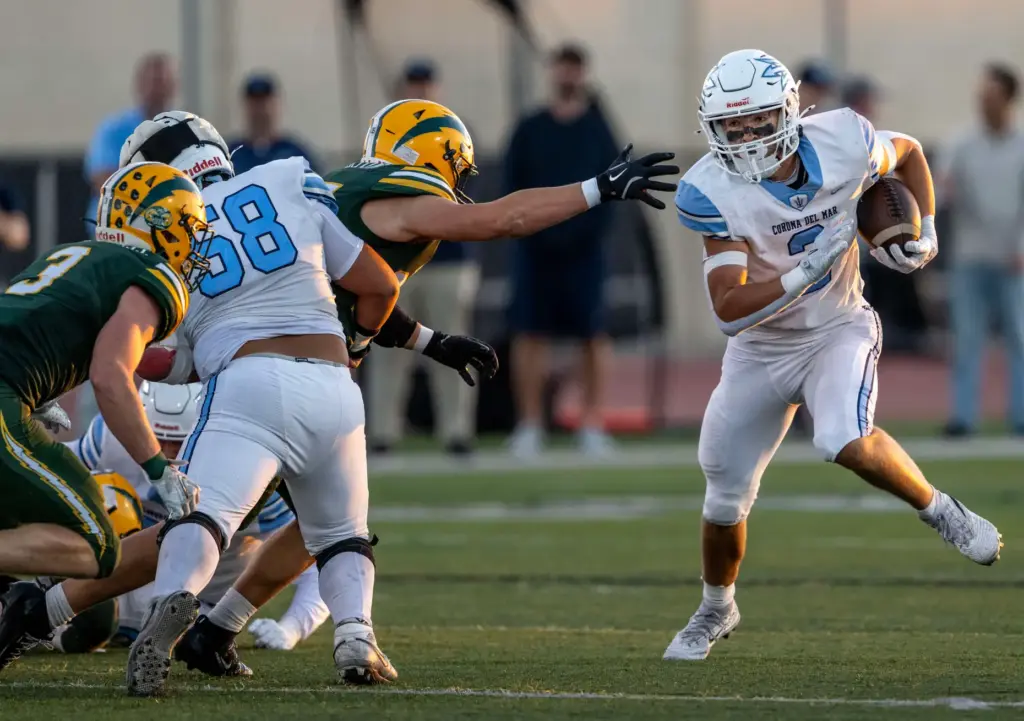 Corona del Mar running back Chase Kuchera (2) carries the...