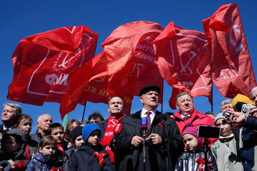 FILE – Russian Communist Party leader Gennady Zyuganov, center, speaks...