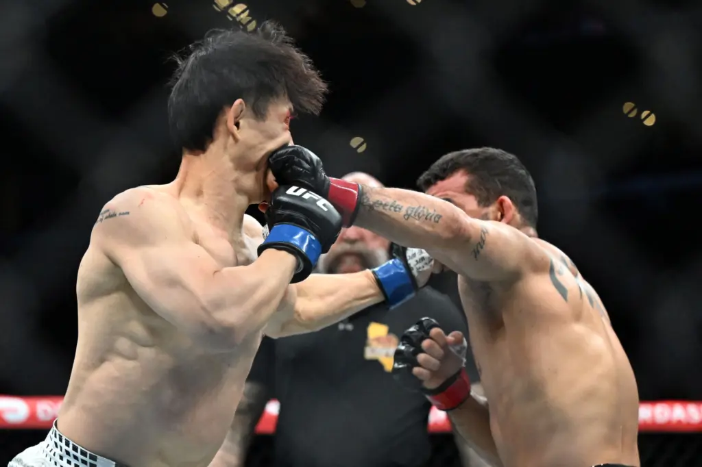 Patricio Pitbull (red) vs. Dooho Choi (blue) during their fight...