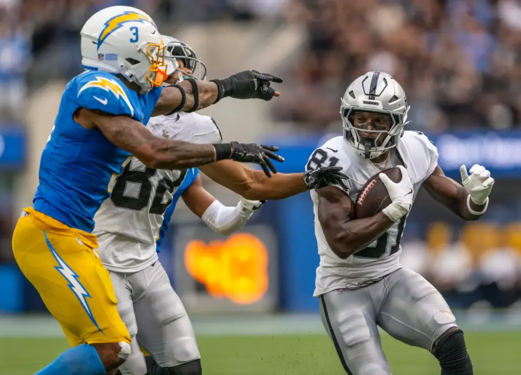Las Vegas Raiders wide receiver Dareke Young (81) carries the...