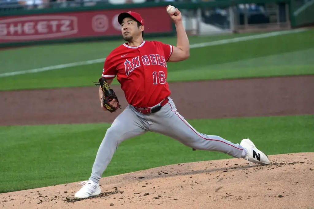 Angels’ Yusei Kikuchi delivers a pitch against the Pittsburgh Pirates...