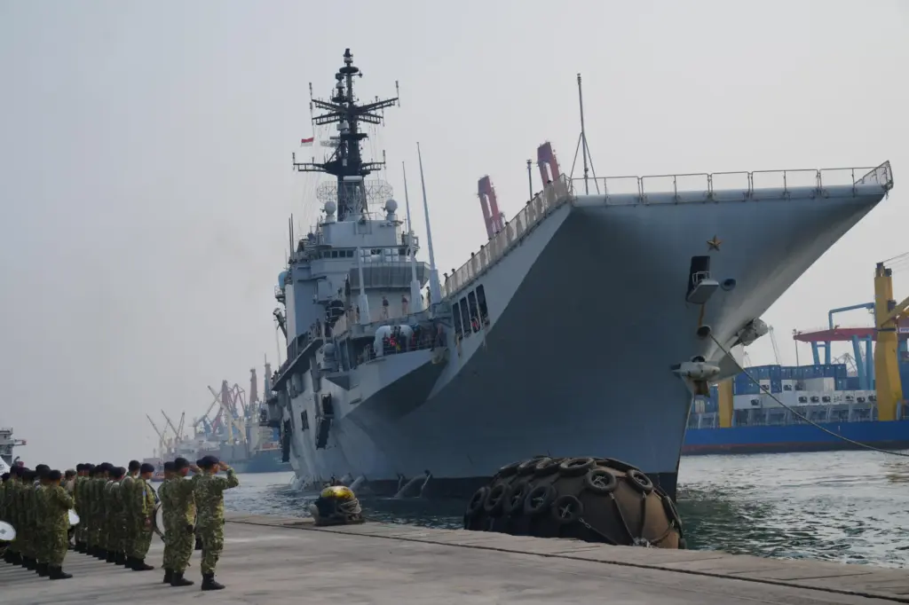 Indonesian Navy personnel salute as the Giuseppe Garibaldi, a former...