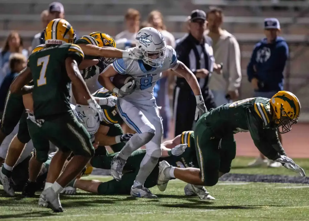 Corona del Mar wide receiver Nolan Scott (8) breaks multiple...