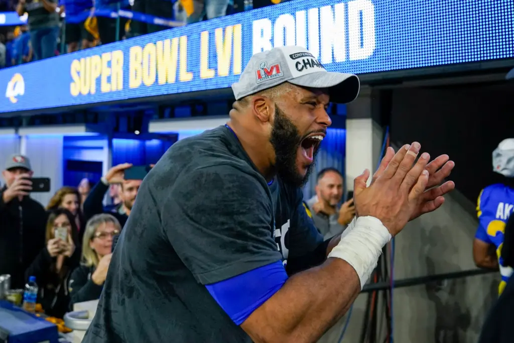 Rams defensive lineman Aaron Donald celebrates after they defeated the...