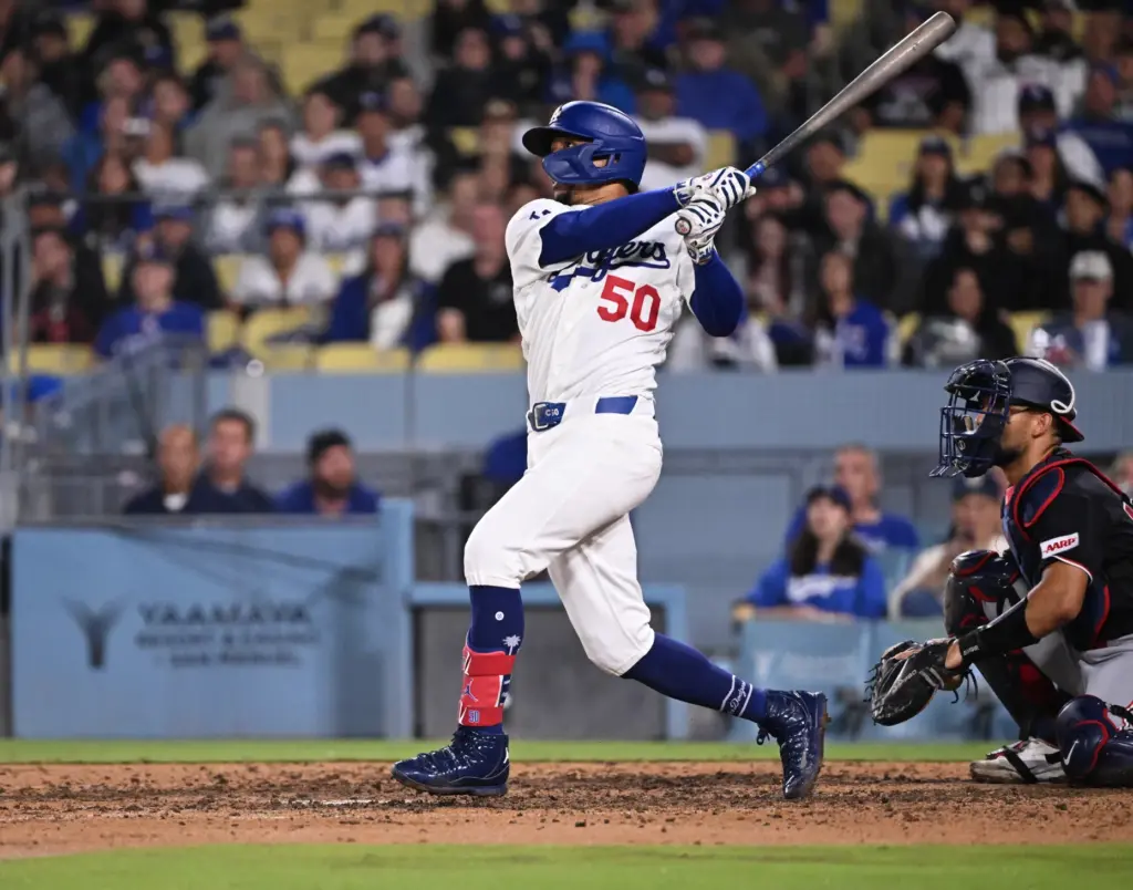 Dodgers shortstop Mookie Betts watches his three-run home run during...