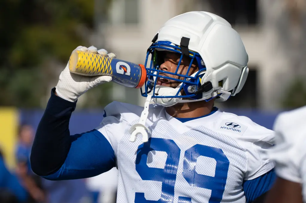 Rams defensive lineman Aaron Donald takes a drink of water...