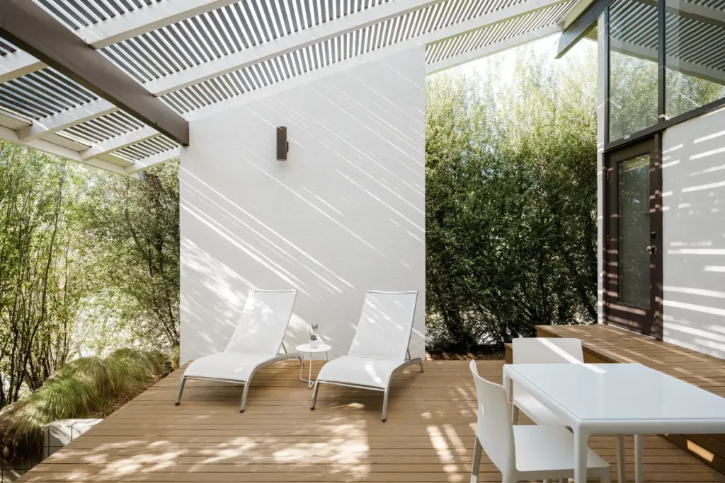 The naturalistic landscape softens the contours of this patio. (Photo...
