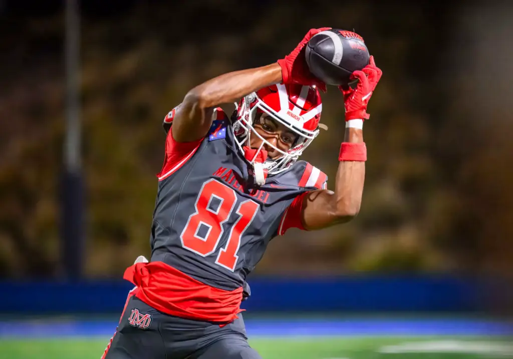 Mater Dei wide receiver Rakim Guyness catches a late game...