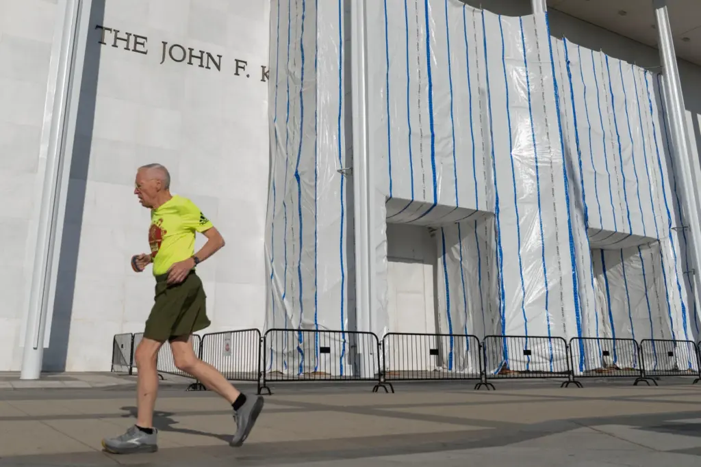 A person jogs outside of the John F. Kennedy Center...