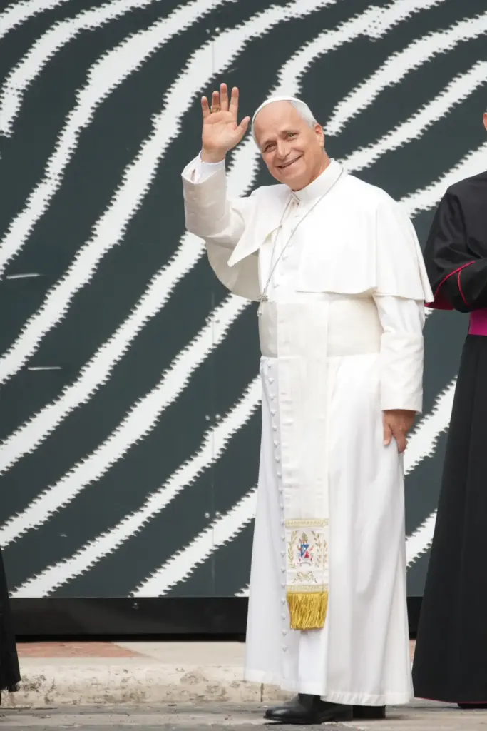 Pope Leo XIV waves as he arrives at the Vatican Library.