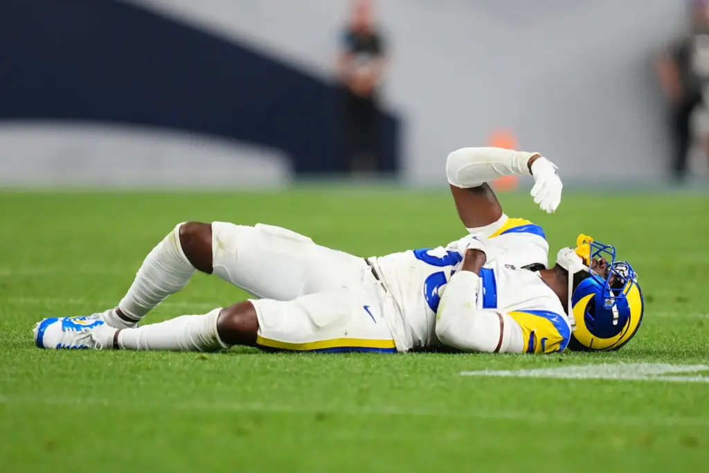 Rams cornerback Jaylen Watson reacts after going down against the...