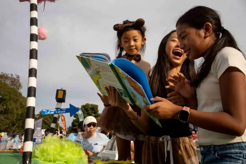 Skylar Kwok, Gemma Kwok, and Ava NuÃ±ez laugh while looking...
