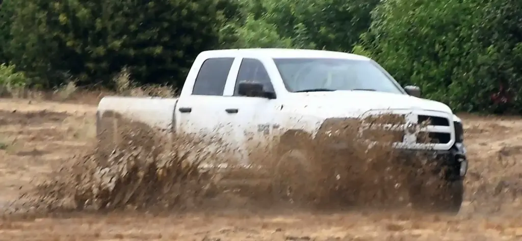 Off roaders enjoy the mud in the rain from Hurricane...