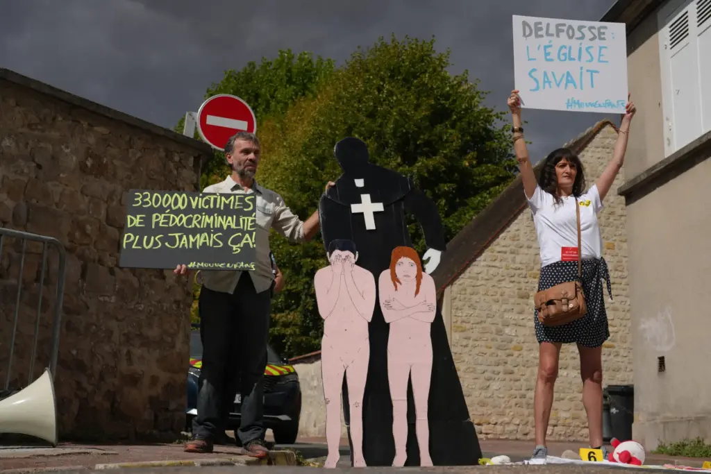 Activists fighting child abuse stage a protest near the home...