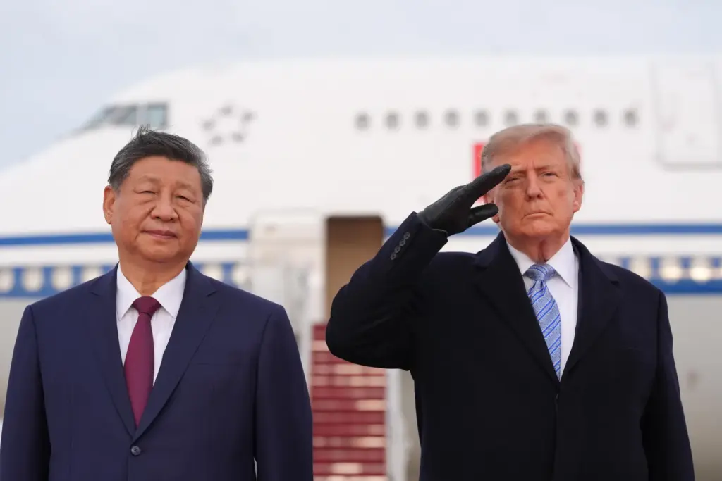President Donald Trump and China's President Xi Jinping participate in an arrival ceremony.