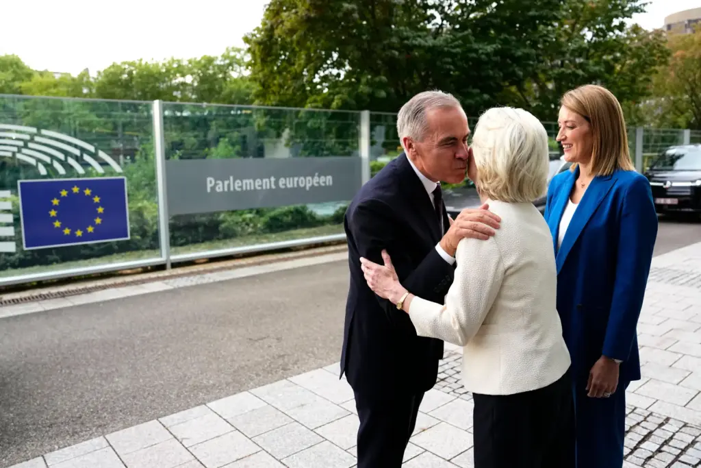 Canadian Prime Minister Mark Carney greets European Commission President Ursula von der Leyen.