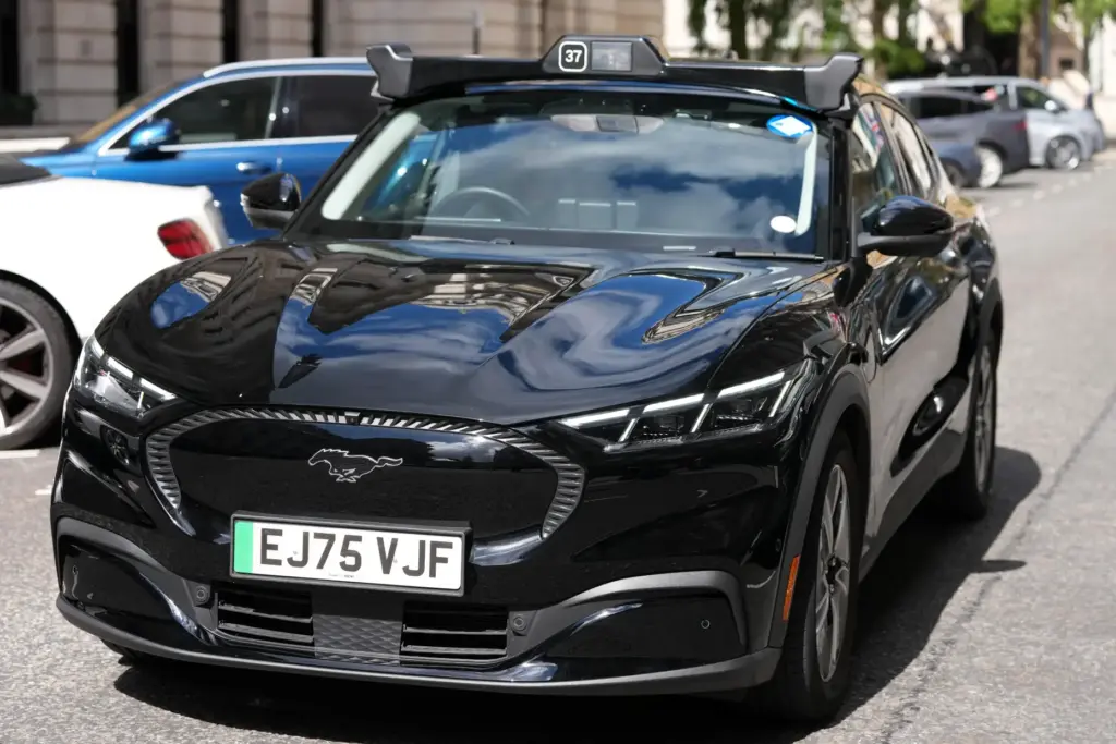 An autonomous car drives through the streets in Westminster, London,...