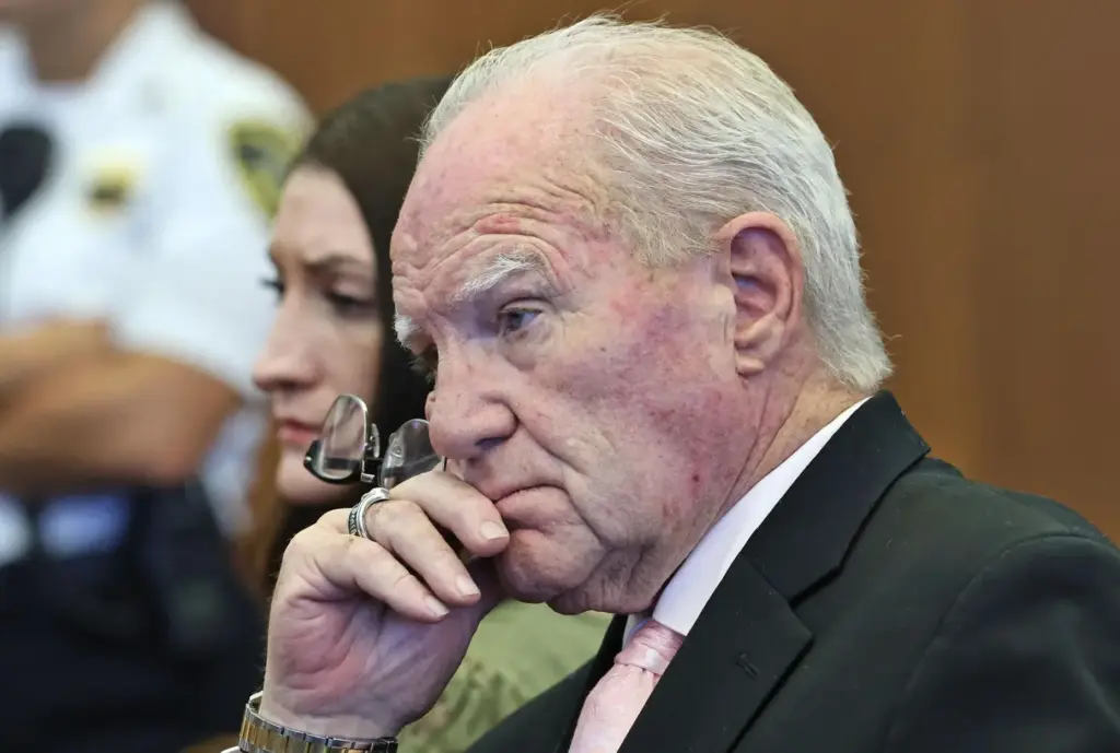 Defense attorney Kevin Reddington and defendant Lindsay Clancy listen to Judge William Sullivan.