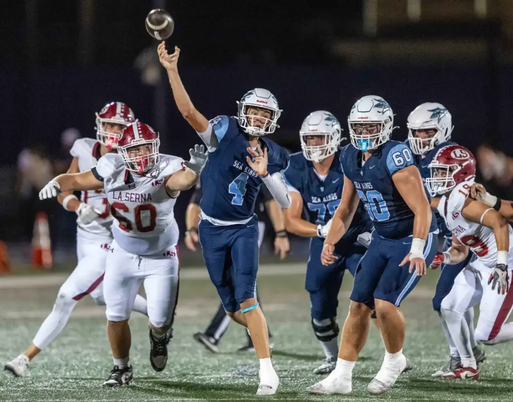 Corona del Mar quarterback John David Annett (4) throws the...