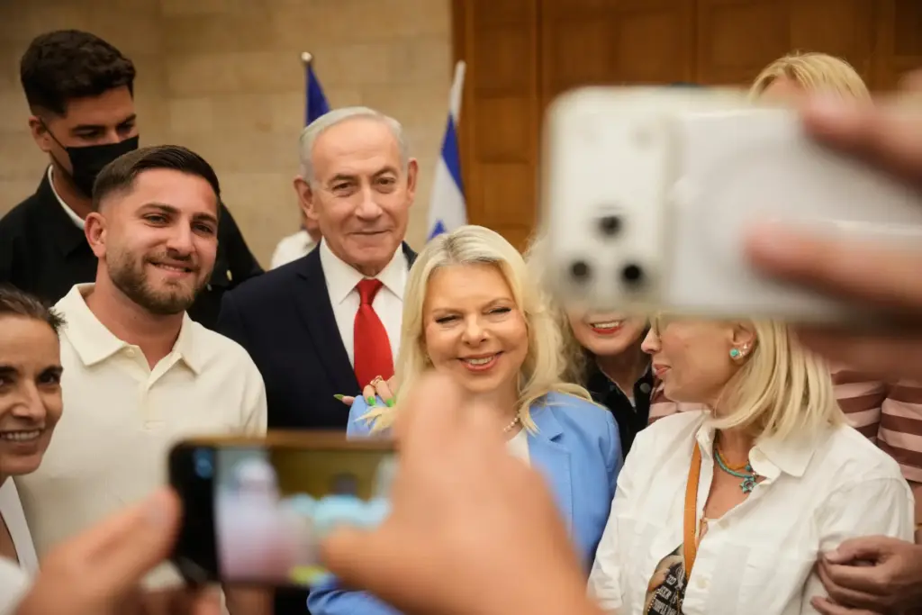 People take a selfie with Israeli Prime Minister Benjamin Netanyahu and his wife, Sara.