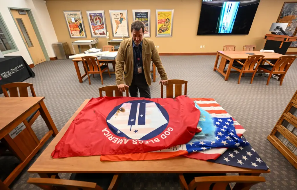 Professor David G. Schwartz looks over artifacts that were part...