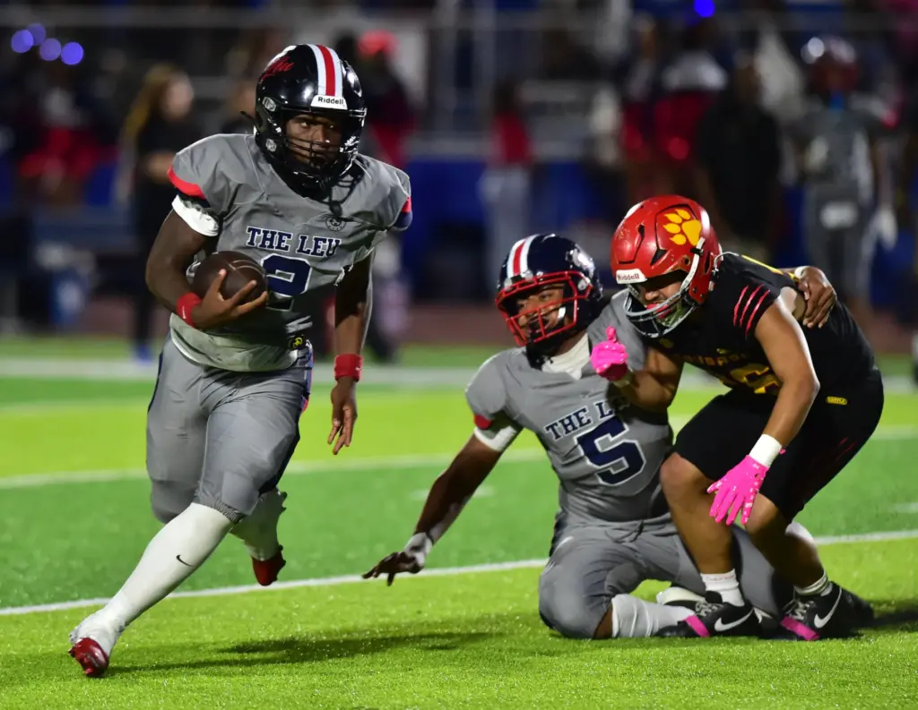 Leuzinger back Milton Jefferson turns corner on Hawthorne defense in...