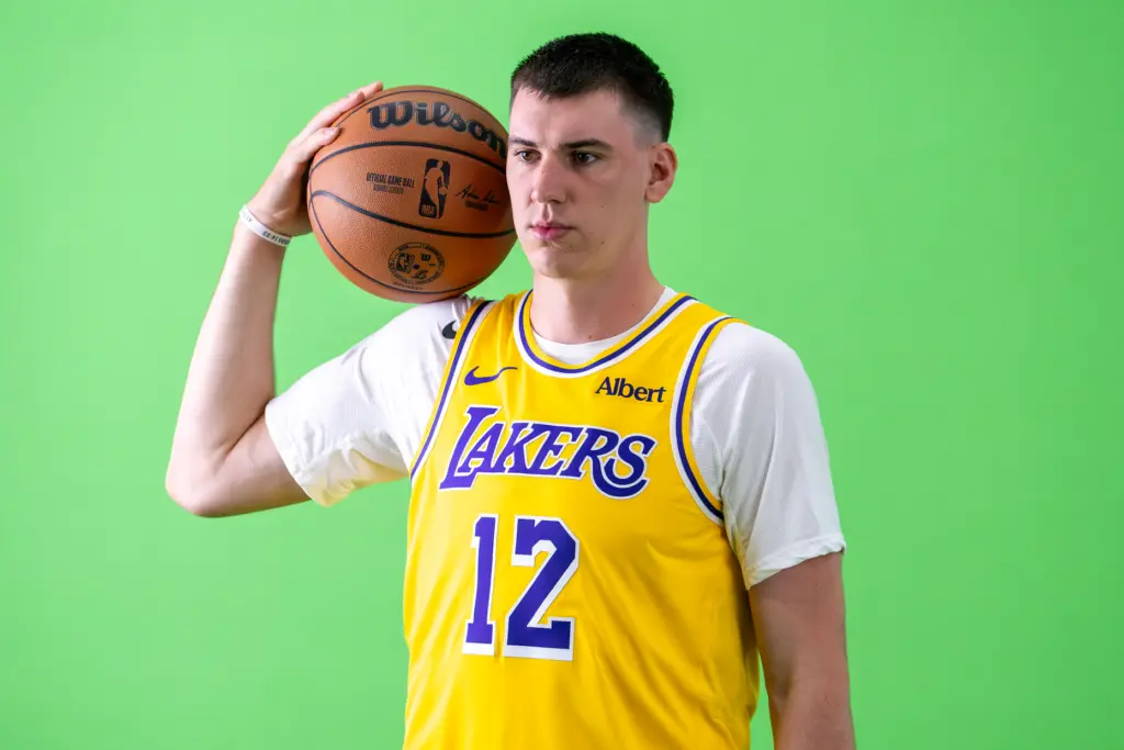 Lakers forward Jake LaRavia poses for photographs during the team’s...