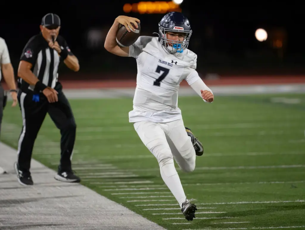 Trabuco Hills quarterback Jackson Verplancke does all he can to...