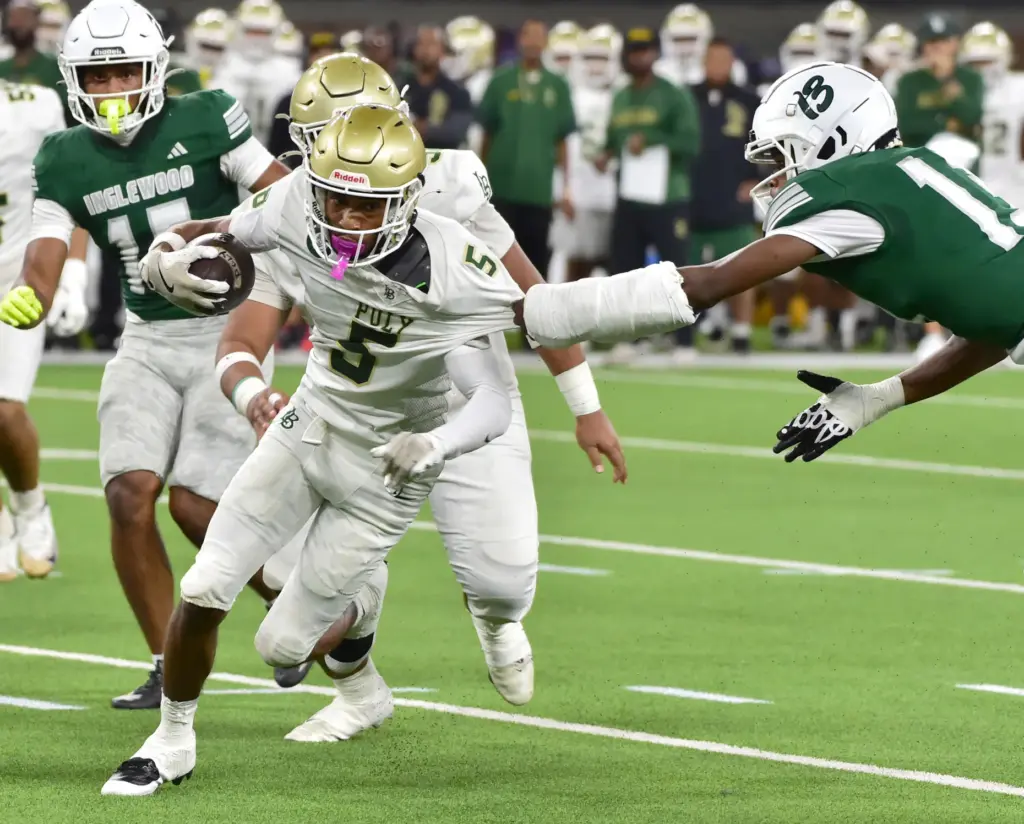 Long Beach Poly receiver Zion Anderson gets grabbed by Inglewood...