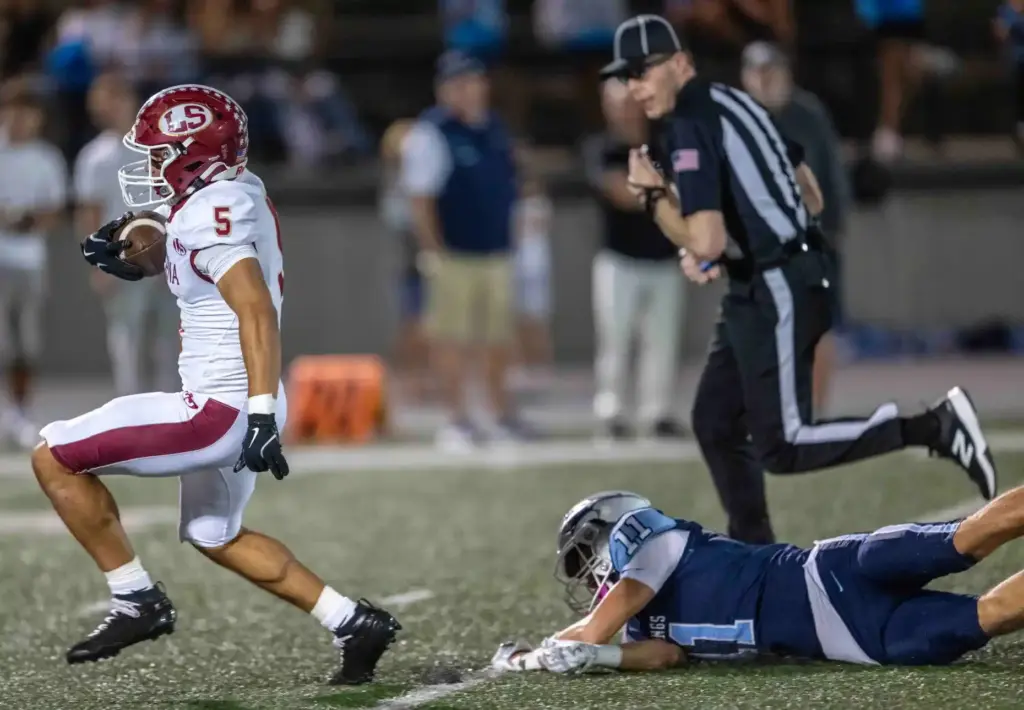 La Serna running back Daniel Moreno (5) carries the ball...