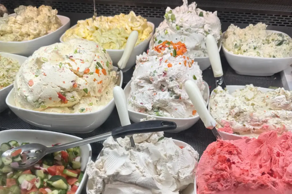Various cream cheeses and bagel fixings appear at Tal Bagels...