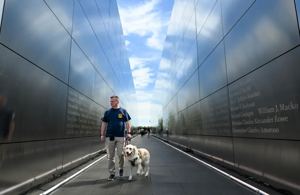 Retired Manasquan police officer Brian Gillespie walks with his service...