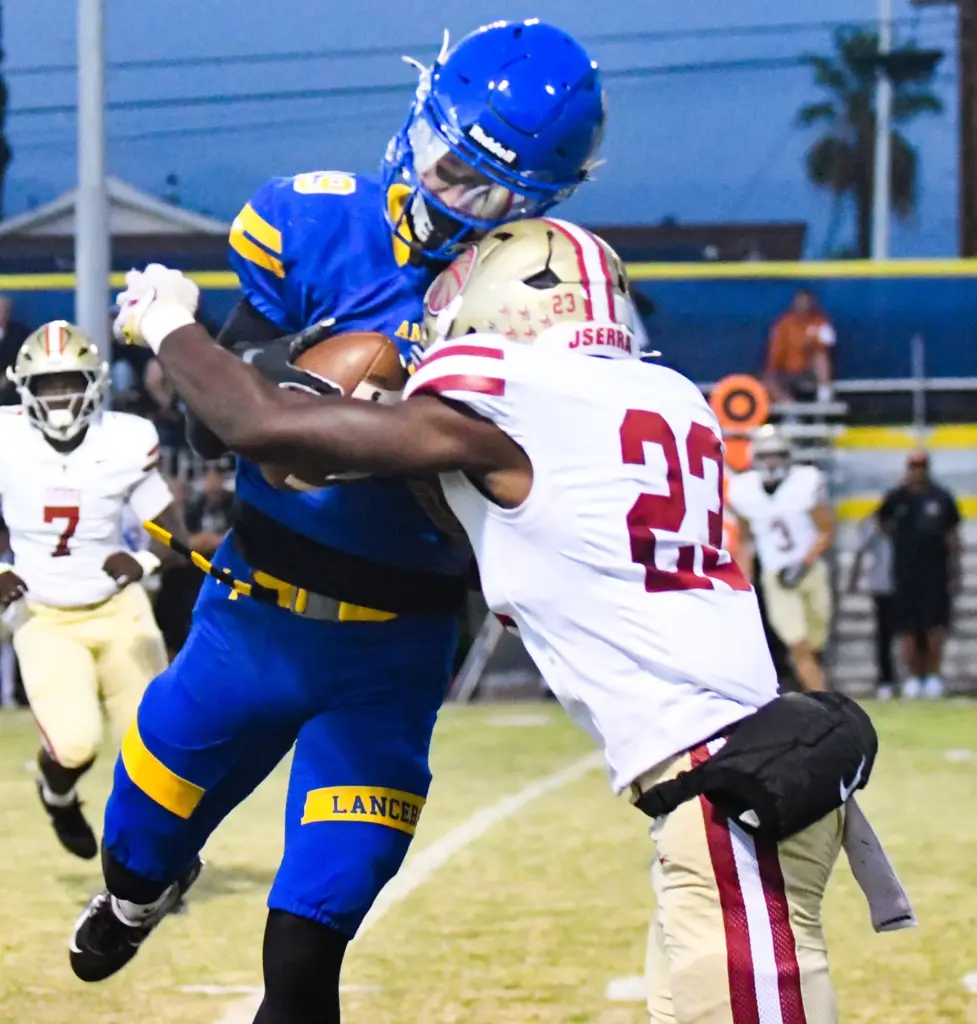 Bishop Amat receiver Miguel Tellez (19) catches a pass as...