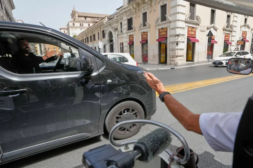 Pascal Duijnhoven argues with a private-hire driver as he drives his golf cart.