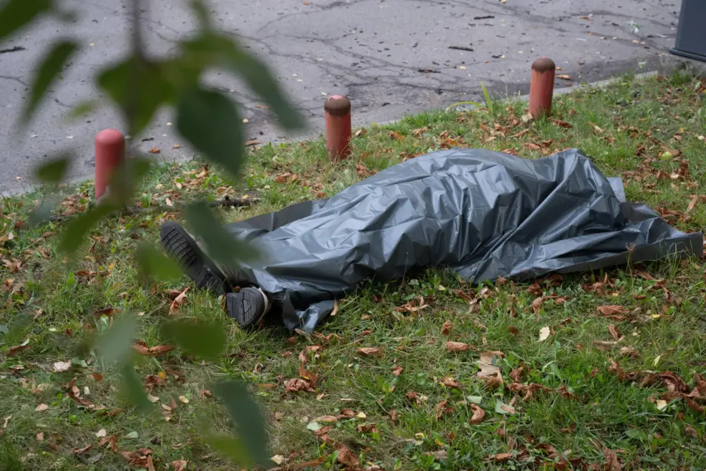 The body of a victim lies on the ground following a Russian drone strike in Kyiv.