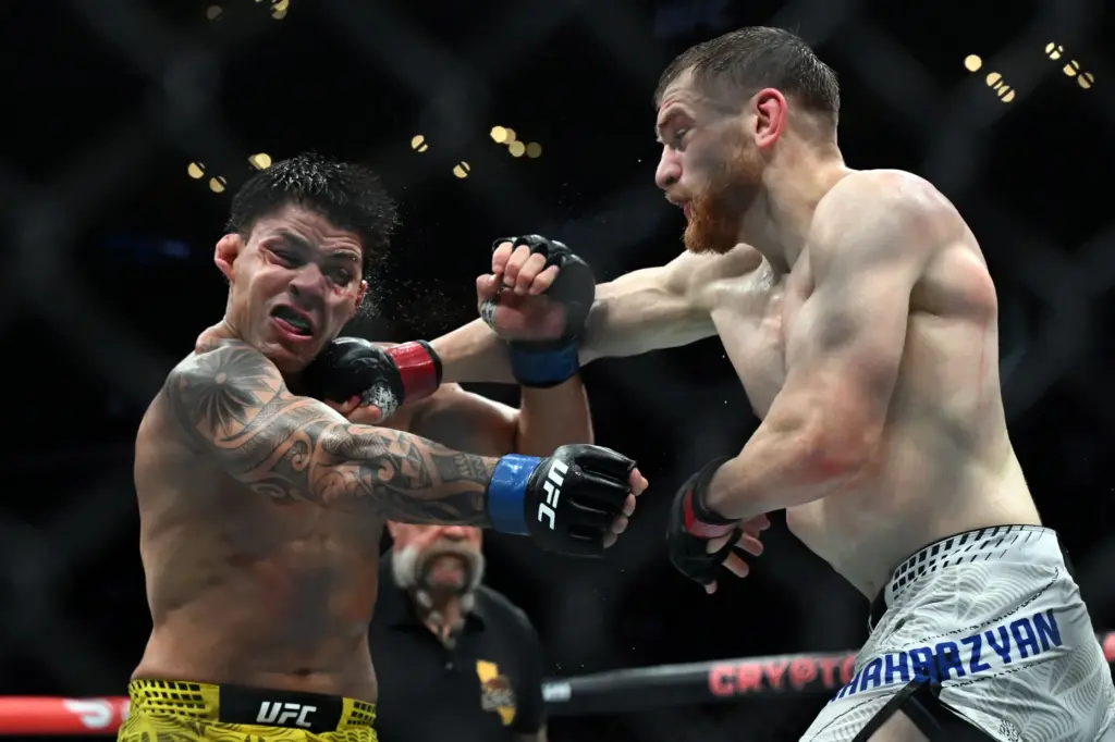 Edmen Shahbazyan connects with a right on Brunno Ferreira during...