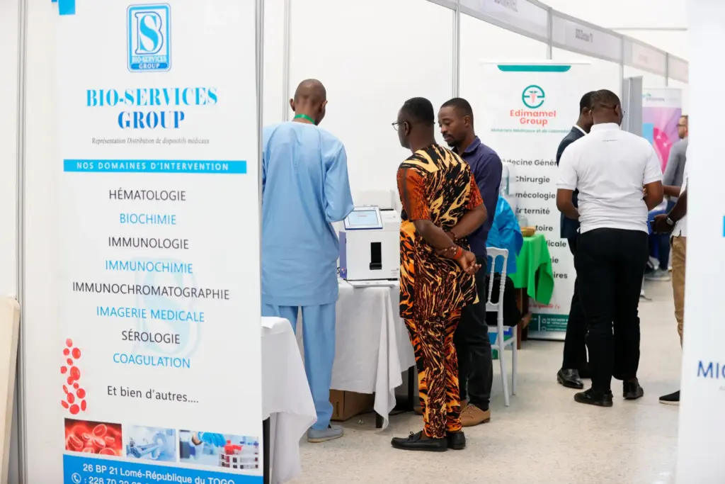 Participants view laboratory equipment at exhibit booths set up during...