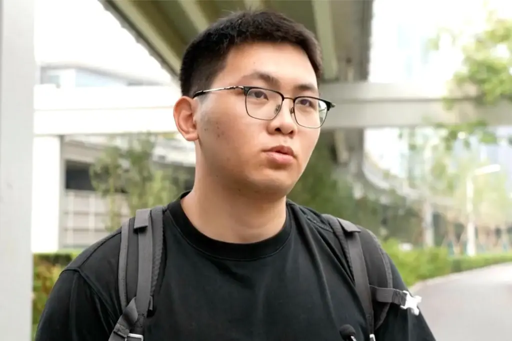 A post-graduate student speaks on the streets of Beijing.