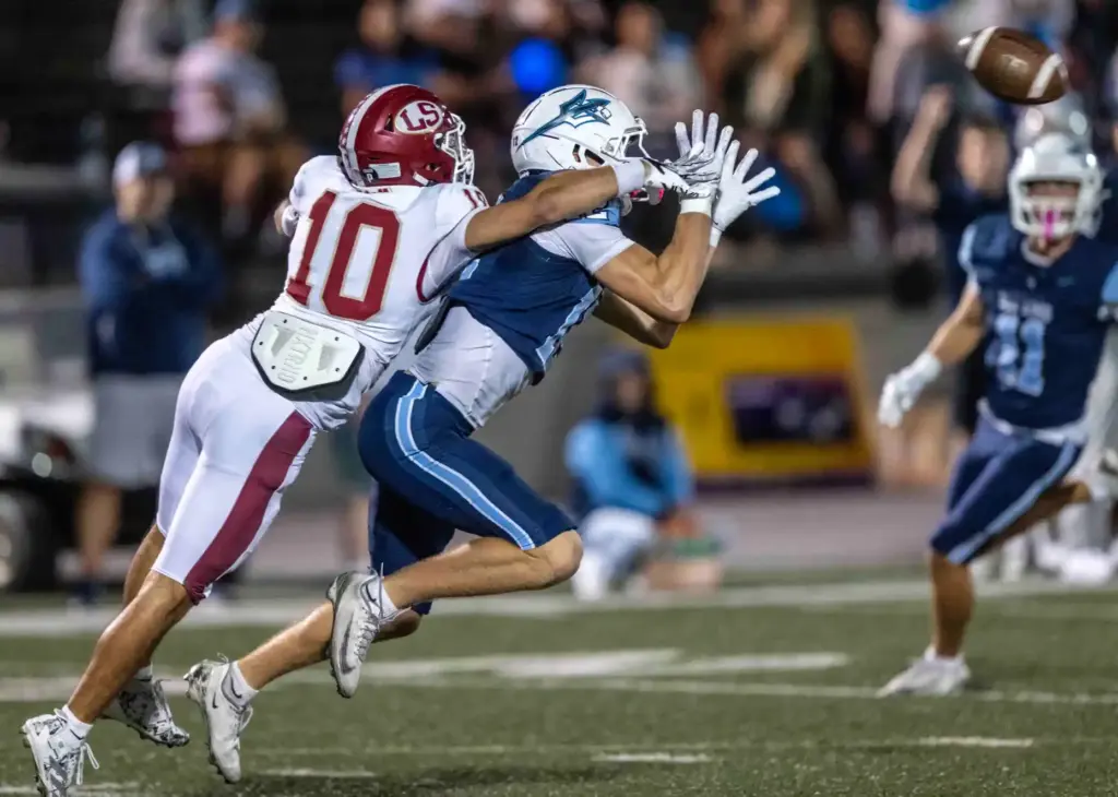 Corona del Mar defensive back Nate Rothman (12) makes an...