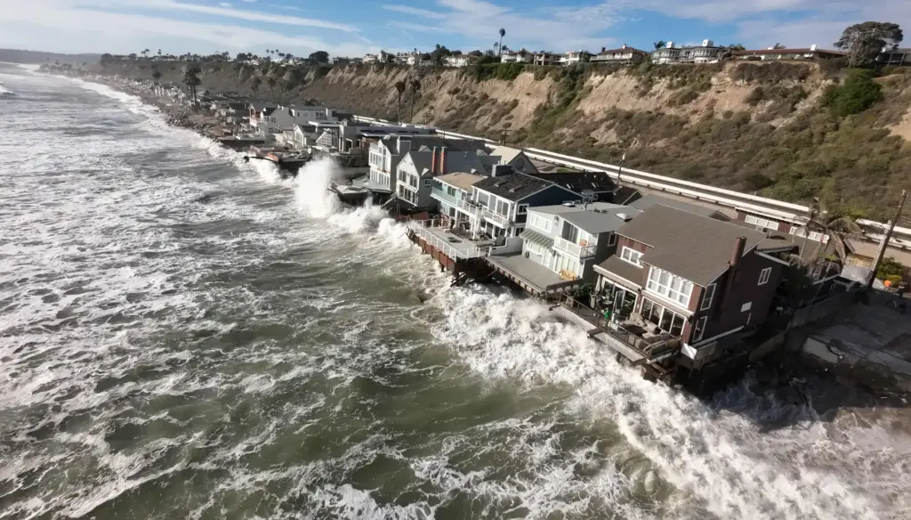 Homes, many of them red tagged, along Beach Road in...