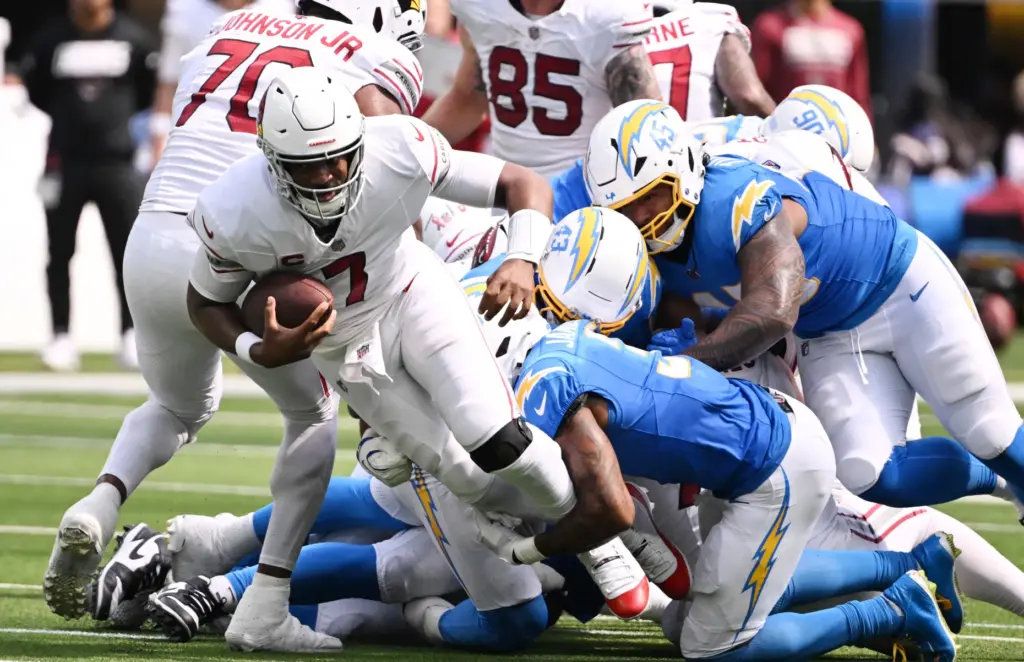 Arizona Cardinals quarterback Jacoby Brissett (7) runs for a first...