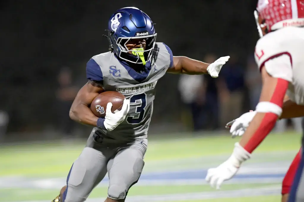 Sierra Canyonâs Jaxsen Stokes carries the ball against Orange Lutheran...